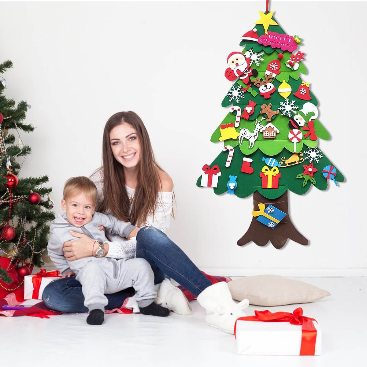 Mother and son sitting next to the Montessori Christmas Tree.